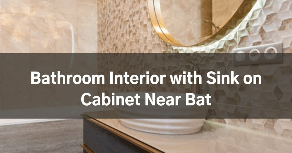 Bathroom Interior with Sink on Cabinet Near Bat