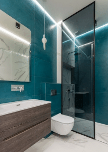 Shower Cabin Near Ceramic Toilet Bowl and Sink in Contemporary Bathroom