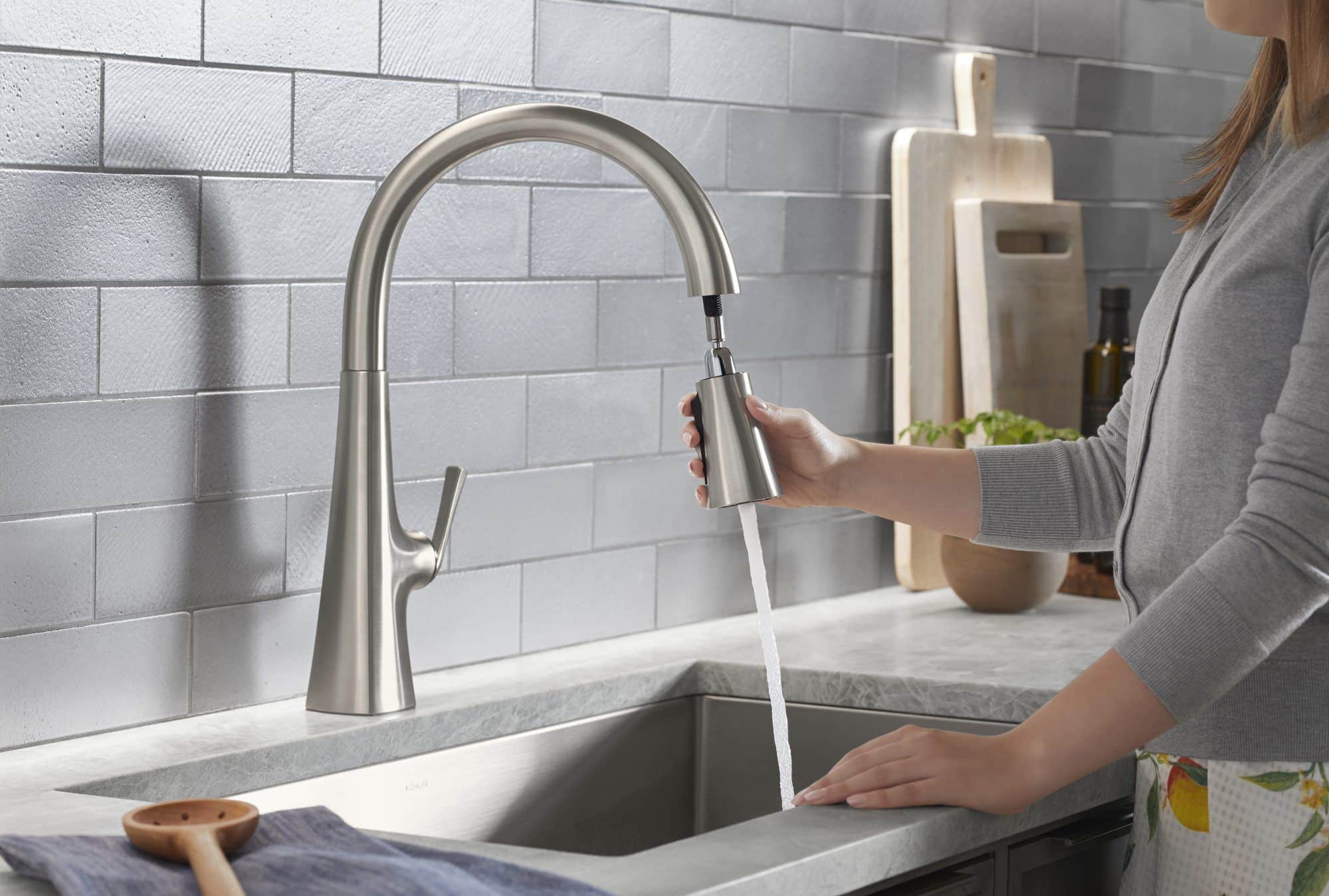 Pull down faucet spray in use