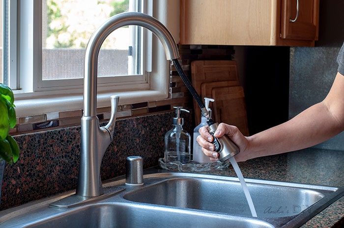 Pull-down faucet head in use