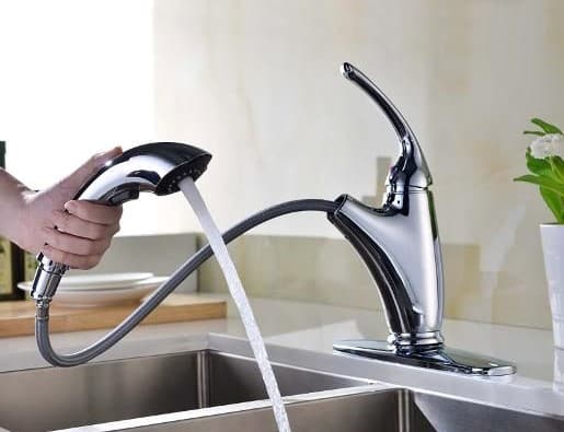 Short spout pull-out kitchen faucet in use