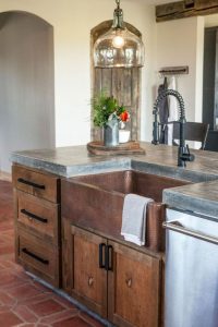 farmhouse sink with black faucet